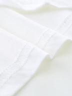 Cream kids T-shirt cotton blend fabric and finished seam, close-up detail view