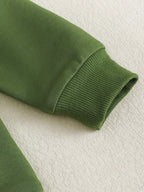 Green baby and toddler sweatshirt with ribbed long-sleeve cuff, detail view