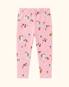 Blush pink kids unicorn print pants with colorful unicorns and flowers, front product view