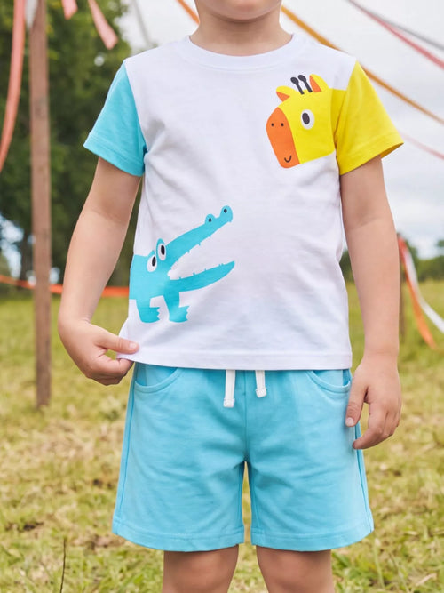 Blue kids giraffe and crocodile graphic tee with matching shorts, modeled front view