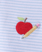 Blue striped kids polo with red apple and yellow pencil embroidery, chest detail view