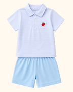 Blue striped kids polo with apple and pencil embroidery and solid blue shorts, front product view