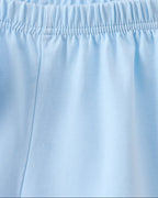 Solid blue kids shorts with elastic pull-on waistband, close-up view