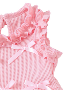 Pink baby bow waffle knit peplum top with layered ruffle shoulder trim, detail close-up