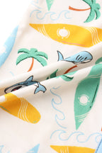 Cream bamboo fabric with blue sharks, colorful surfboards, palm trees and waves, print close-up