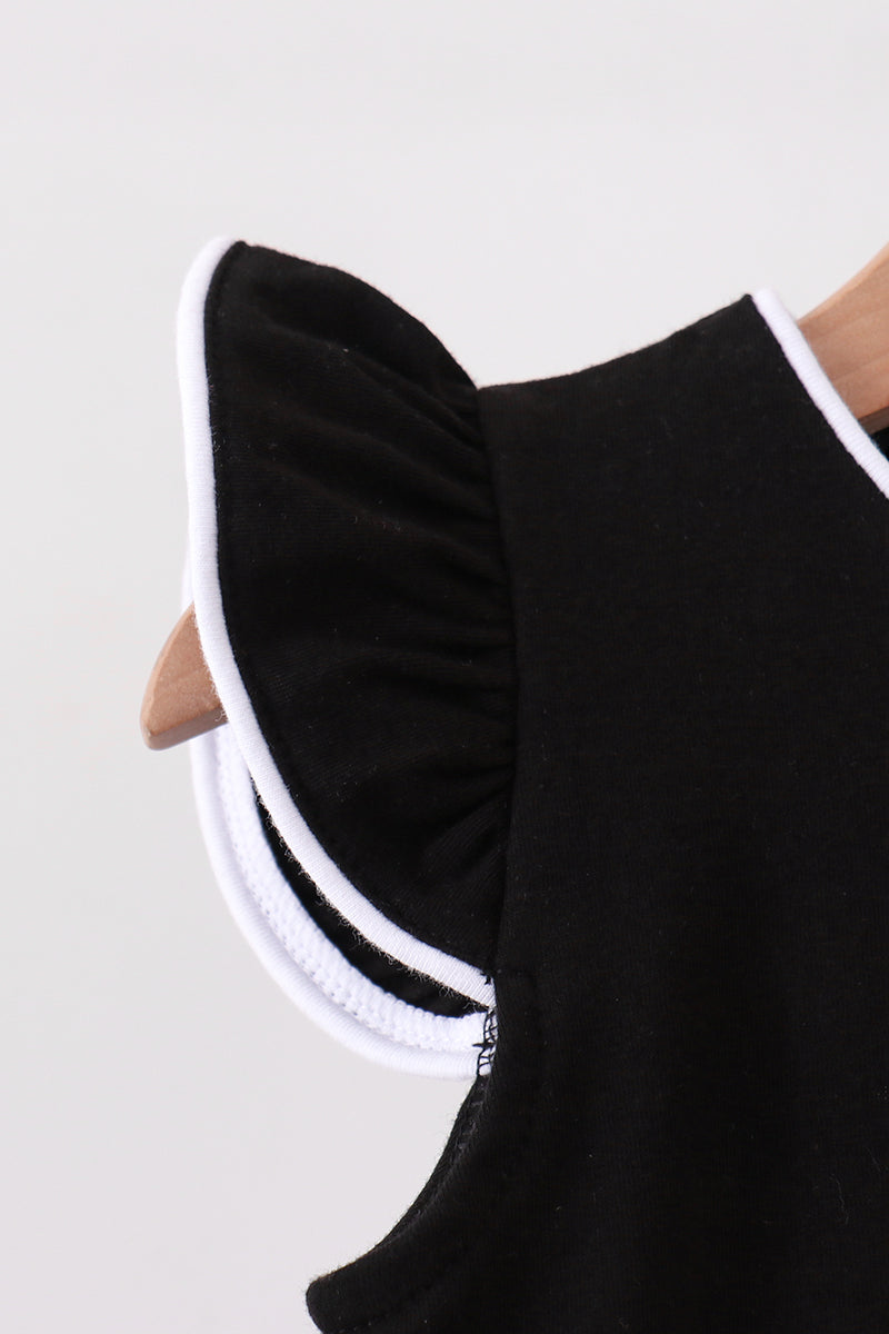 Black kids flutter sleeve with white contrast edging, close-up detail view
