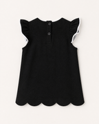 Black kids flutter-sleeve top with two-button back opening and scalloped hem, rear product view