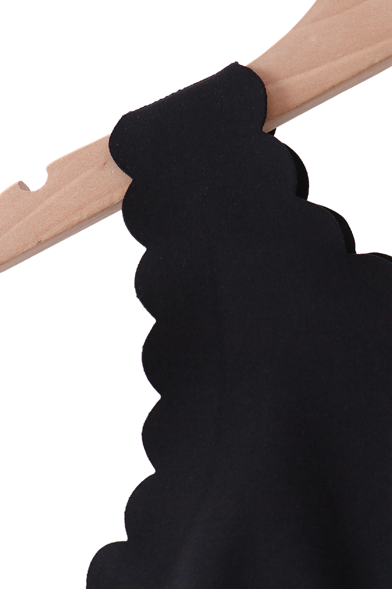 Black scalloped active top shoulder strap, close-up detail view