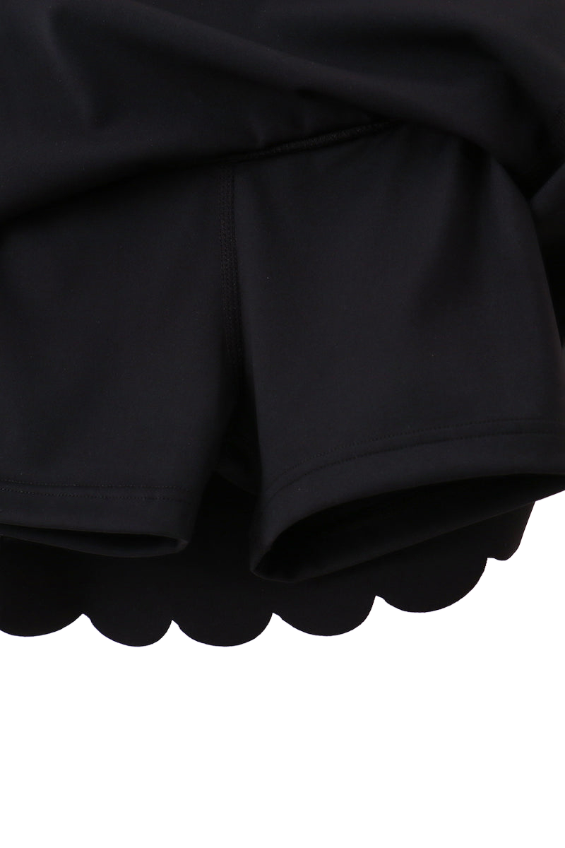 Black kids active skort with built-in fitted shorts, underside detail view