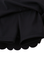 Black kids active skort with built-in fitted shorts, underside detail view