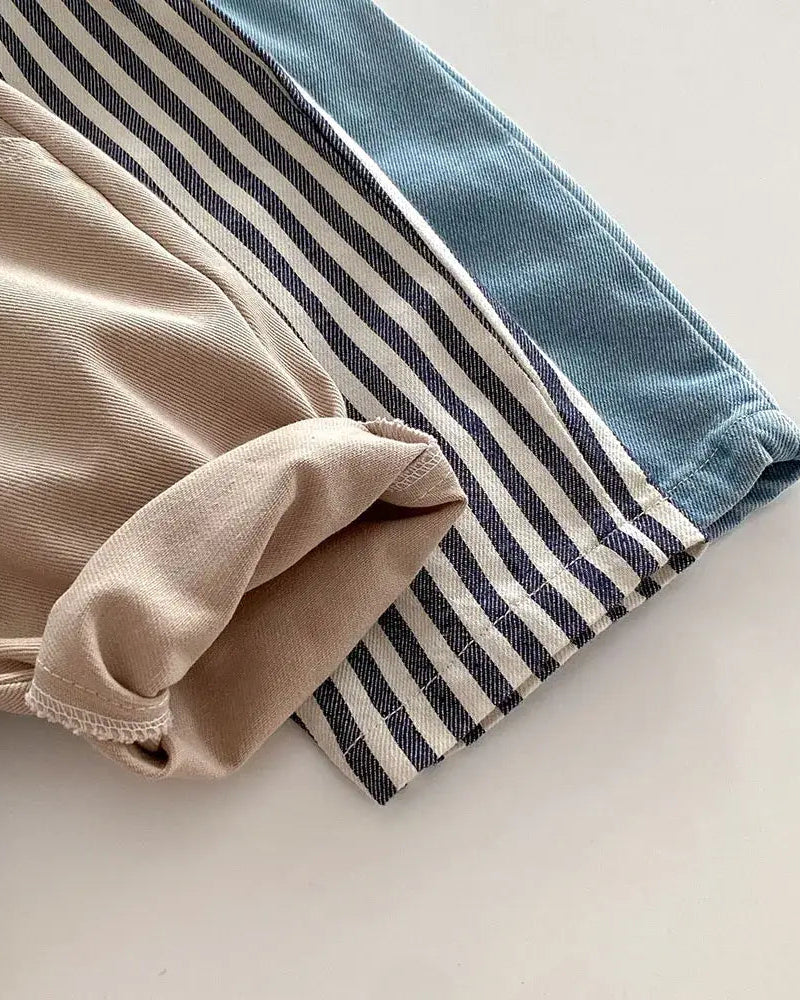 Blue tapered trousers beside khaki and striped styles, color and fabric comparison view