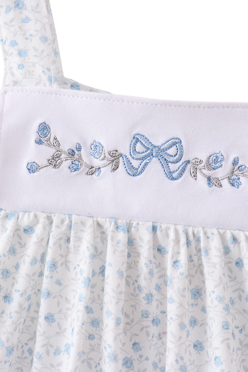 Blue floral kids top with bow and flower embroidery on white yoke, close-up front view