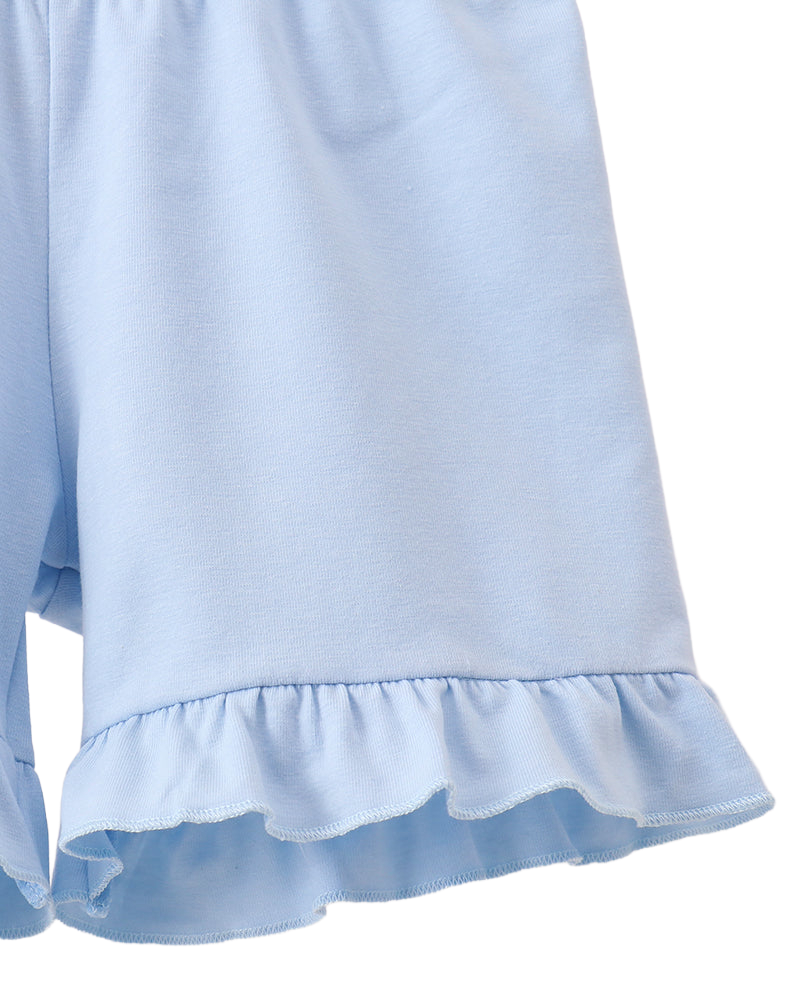 Solid blue kids shorts with ruffle-trim hem, close-up view