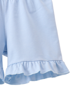 Solid blue kids shorts with ruffle-trim hem, close-up view