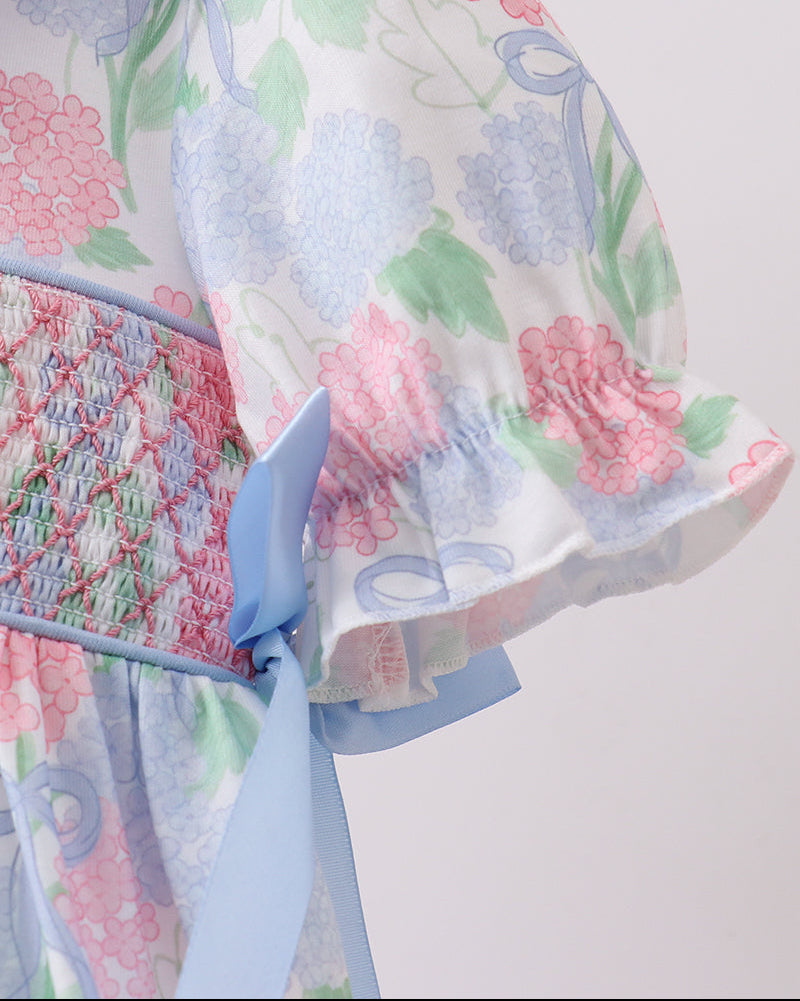 Blue and pink hydrangea kids dress with puff sleeve and blue side tie, detail view