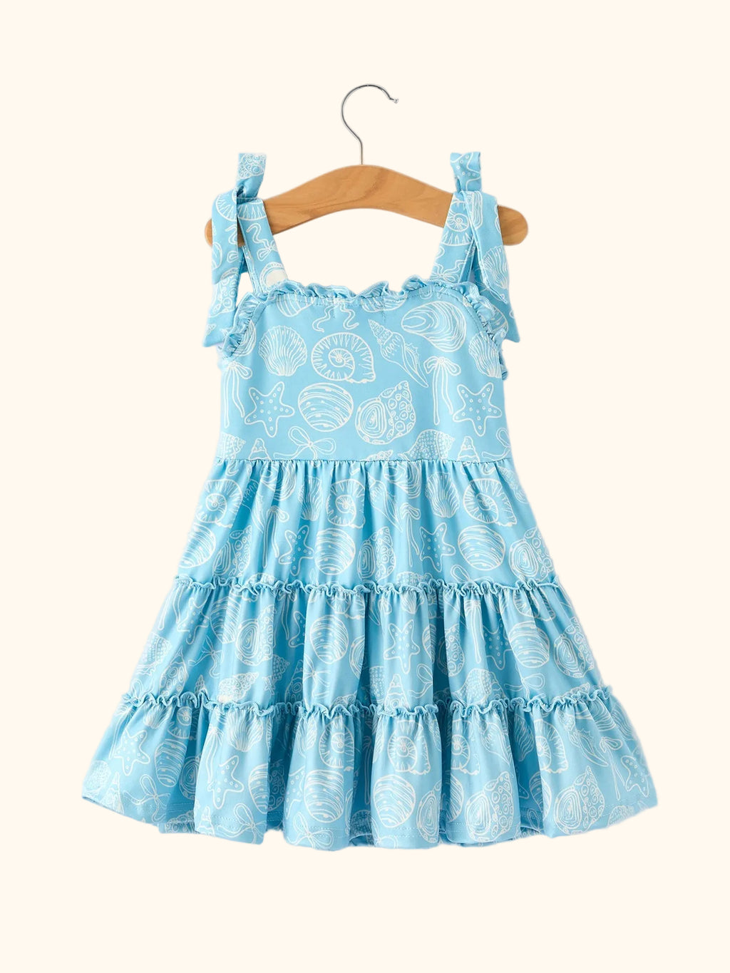 Blue kids ocean seashell tie-shoulder dress with tiered ruffle skirt, back hanging view