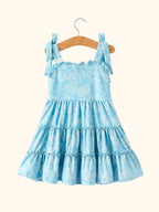 Blue kids ocean seashell tie-shoulder dress with tiered ruffle skirt, back hanging view