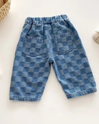 Blue checker plaid kids tapered trousers with two back patch pockets, back view