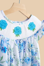 Blue rose hand-smocked dress with embroidered yoke and flutter sleeve, front detail view