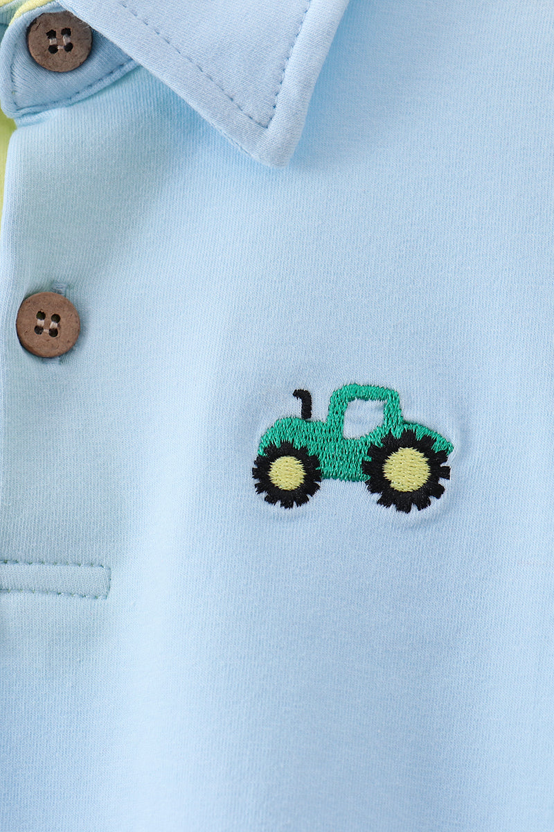 Light blue tractor embroidered kids polo shirt, modeled front view