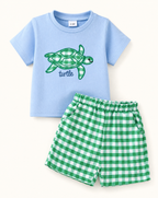 Blue baby turtle appliqué tee with green gingham pocket shorts, front product view