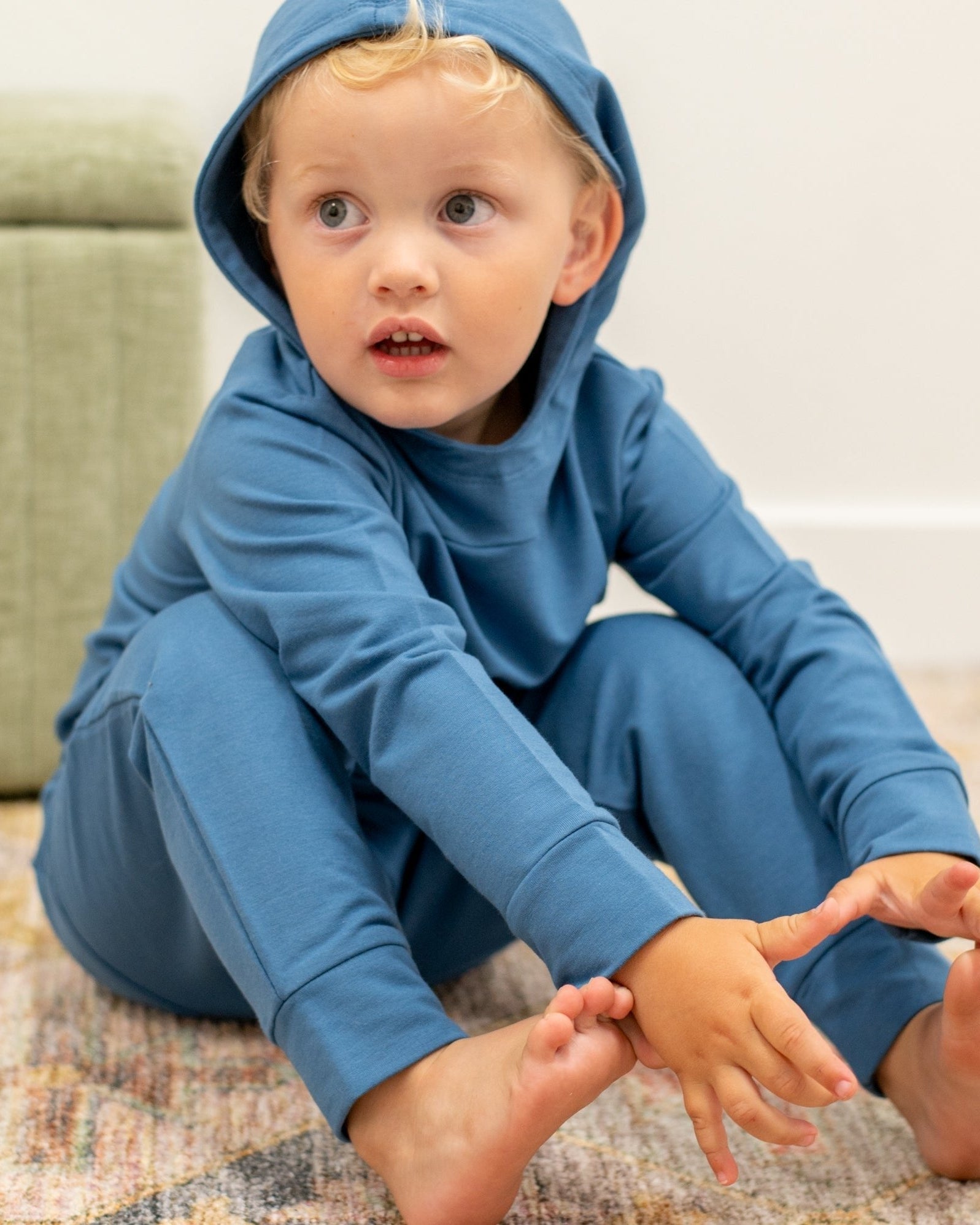 Captain blue kids hooded jogger set with matching pants, seated lifestyle view