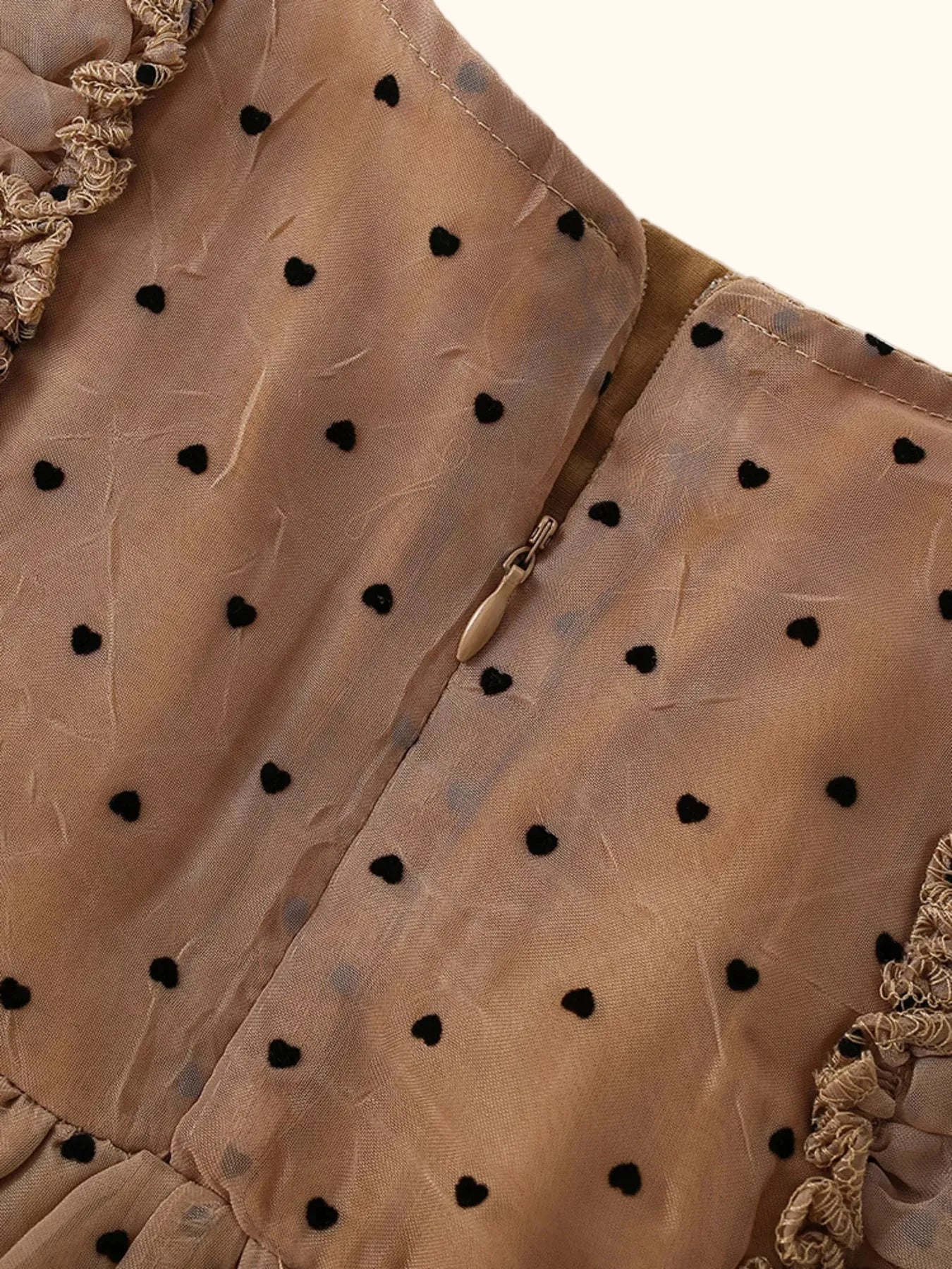 Caramel polka dot ruffle dress with back zipper closure, close-up back view
