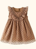 Caramel kids polka dot ruffle dress with gathered skirt and black dots, flat lay front view