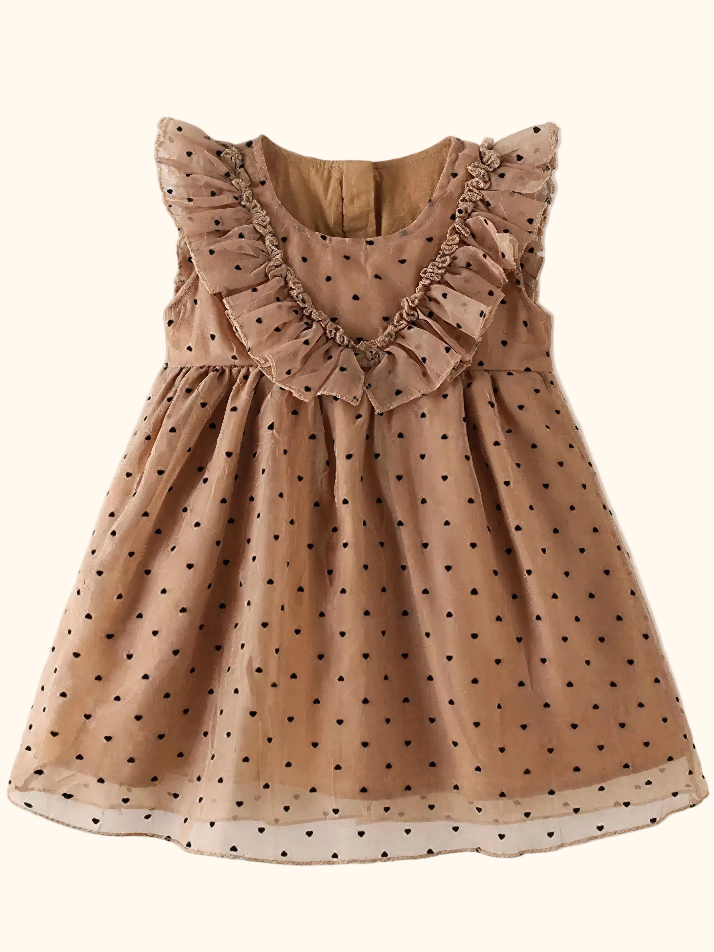 Caramel kids polka dot ruffle dress with gathered skirt and black dots, flat lay front view
