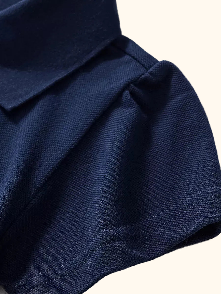 Dark navy kids unicorn polo with gathered short puff sleeve, sleeve detail view