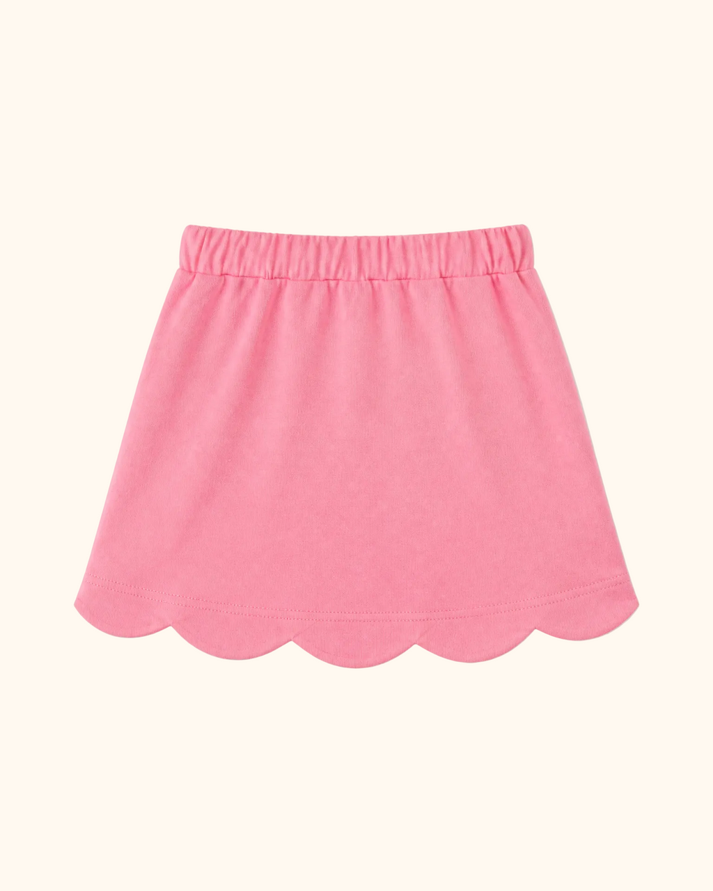 Deep pink kids skort with scalloped hem and elastic waistband, back view