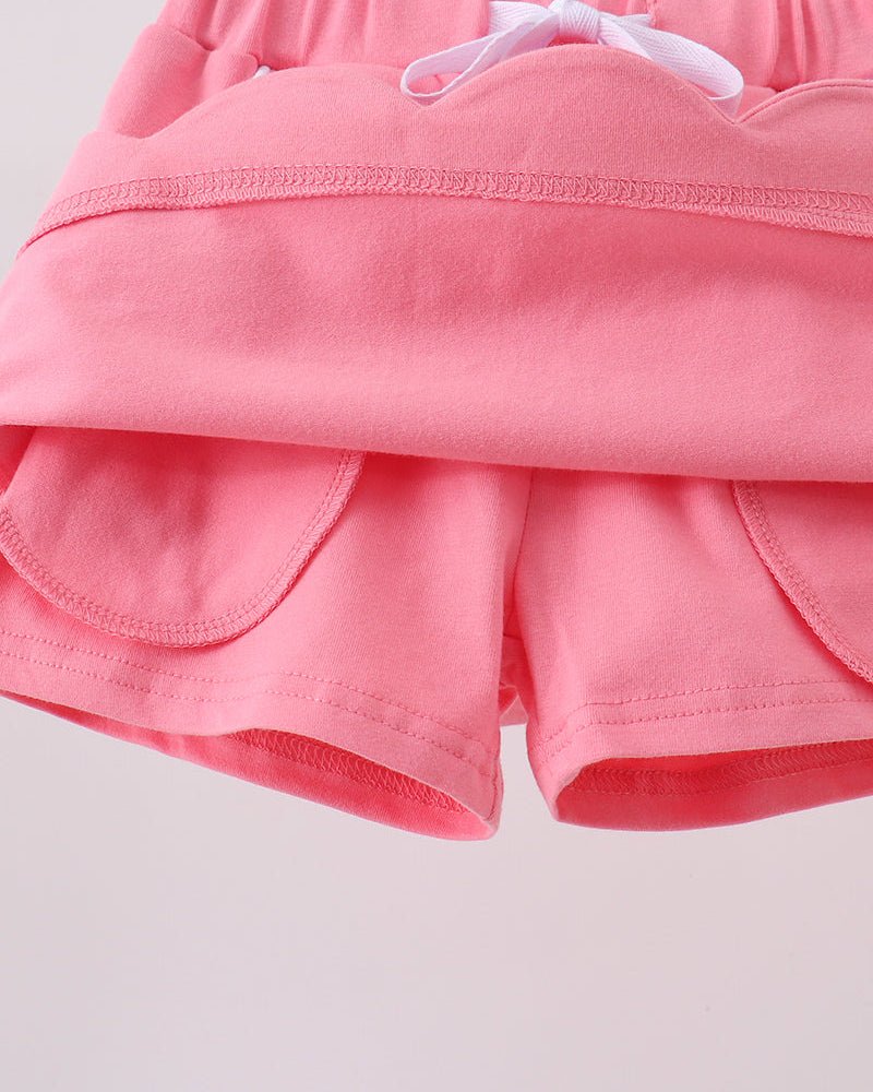 Deep pink kids skort with built-in shorts beneath skirt overlay, interior detail view