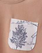Khaki kids T-shirt with deer forest print chest pocket, close-up view