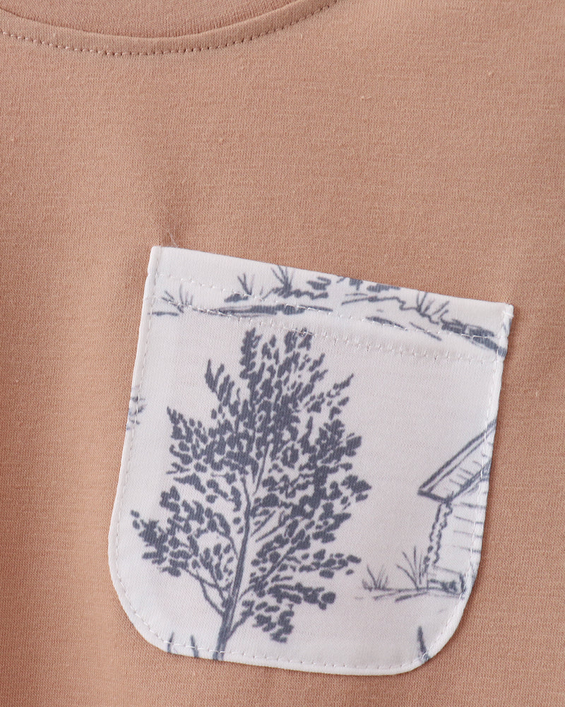 Khaki kids T-shirt with deer forest print chest pocket, close-up view