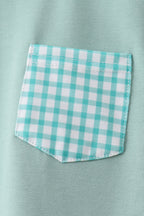 Green kids T-shirt with gingham chest pocket, close-up view