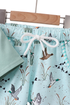 Duck print kids shorts with drawstring waist and gingham-trim pockets, close-up view