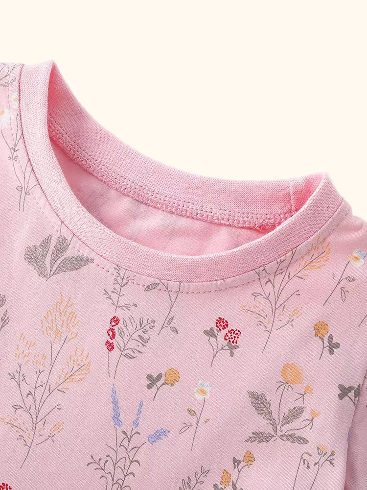 Dusty pink kids floral print dress with allover flower pattern, front detail view