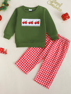 Green baby and toddler sweatshirt with red truck embroidery and red gingham pants, front product view