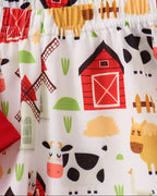 Farm animal print kids shorts with cows, horses, barns and elastic waistband, close-up view