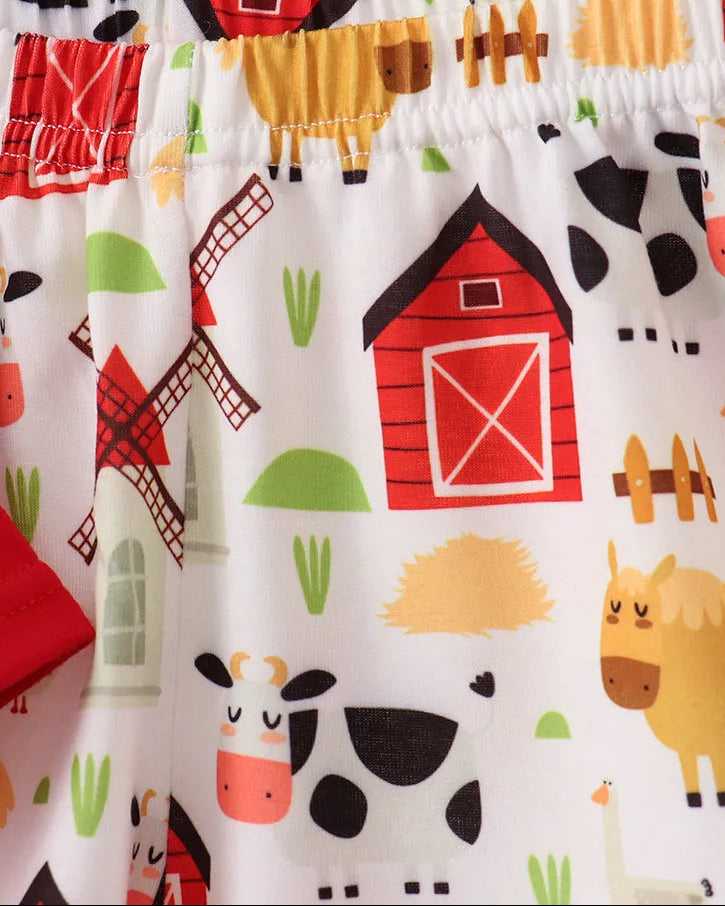 Farm animal print kids shorts with cows, horses, barns and elastic waistband, close-up view