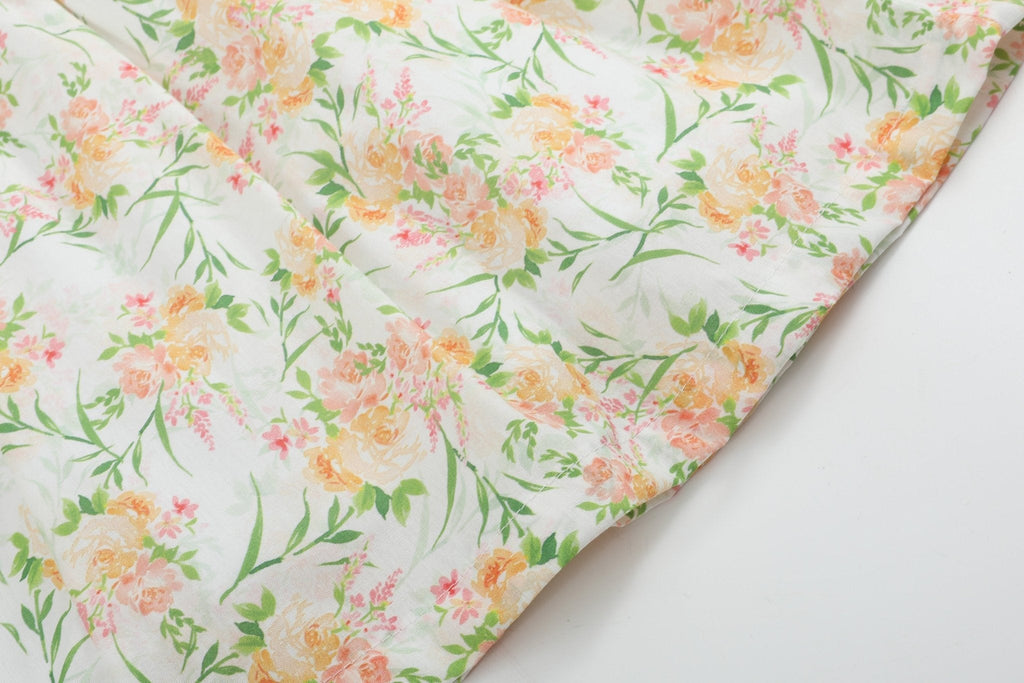 Ivory kids dress with peach pink and green botanical floral print,  