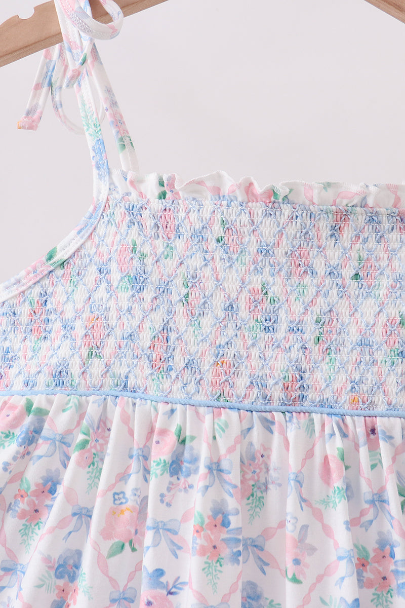 Floral kids dress with multicolor smocked bodice and tie strap, close-up view