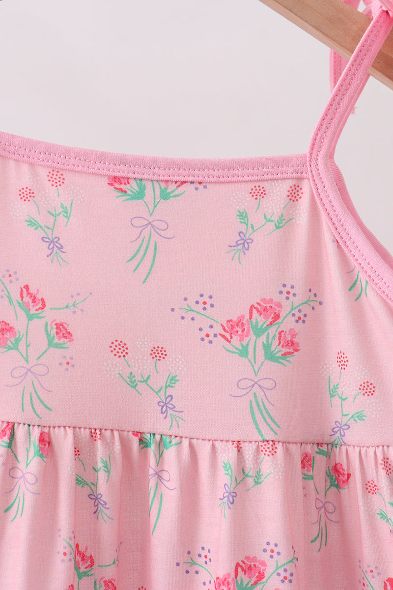 Pink floral kids dress with bound neckline and floral bouquet print, bodice close-up