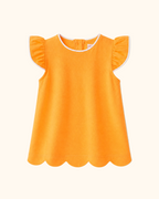 Orange kids flutter-sleeve top with white piping and scalloped hem, front product view