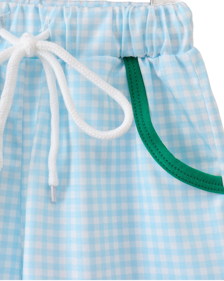 Blue gingham kids shorts with green-trim pockets and white drawstring, close-up view