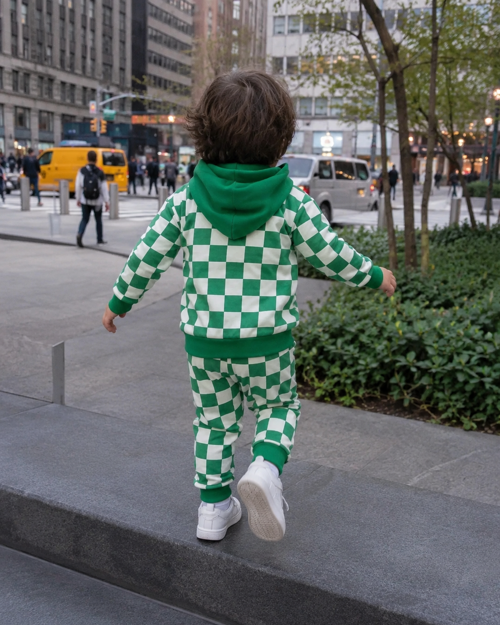 Green checkerboard kids hooded jogger set with solid green hood and cuffs, modeled back view