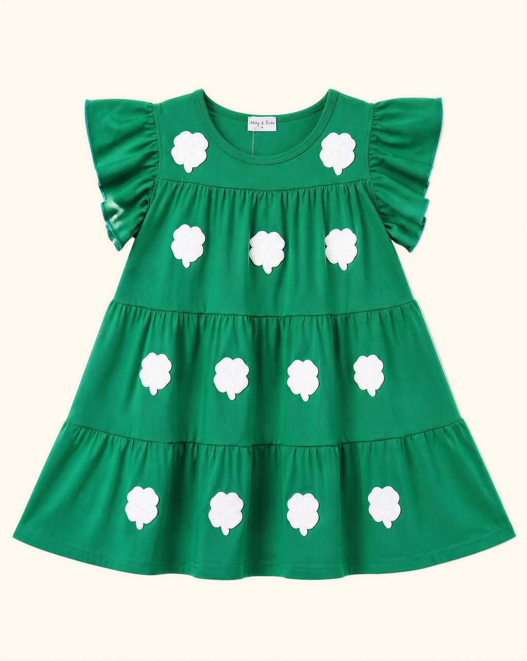 Green kids tiered dress with white sequin clover appliqués and flutter sleeves, front product view
