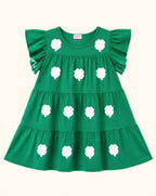 Green kids tiered dress with white sequin clover appliqués and flutter sleeves, front product view