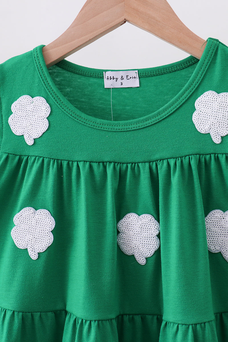 Green sequin clover kids dress with round yoke and flutter sleeves, upper front detail view