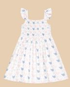 White kids bamboo smocked dress with flutter straps and pastel hen print, back product view